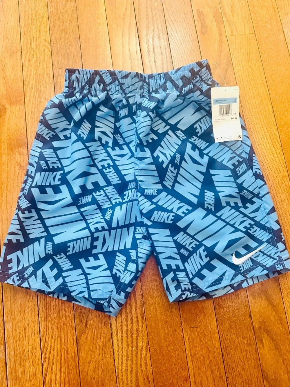 Nike Boys Swim Trunks Blue All-Over Logo Print – Size M (NWT) Athletic Shorts - Picture 1 of 3